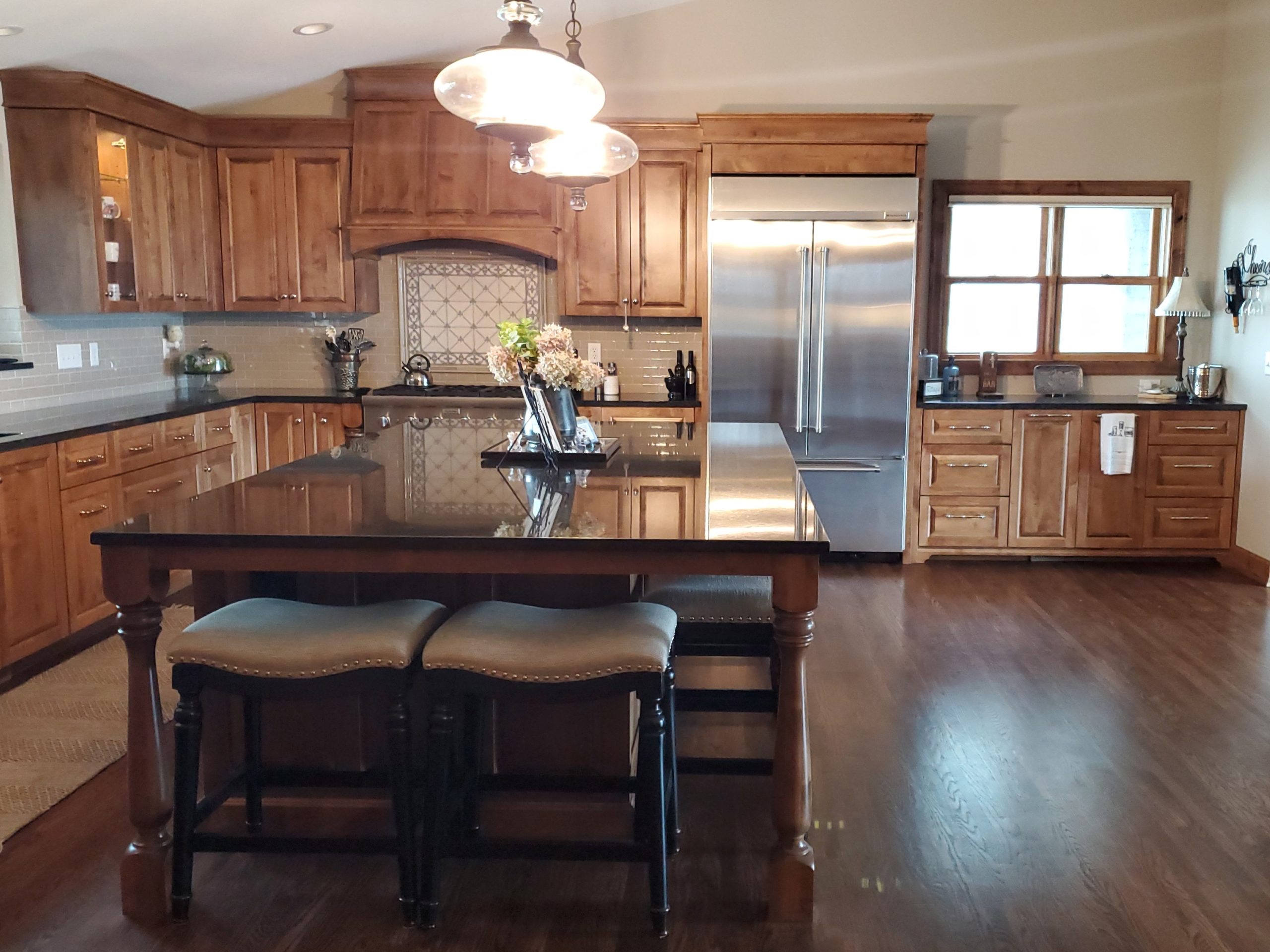 Modern kitchen with wooden cabinets and granite island