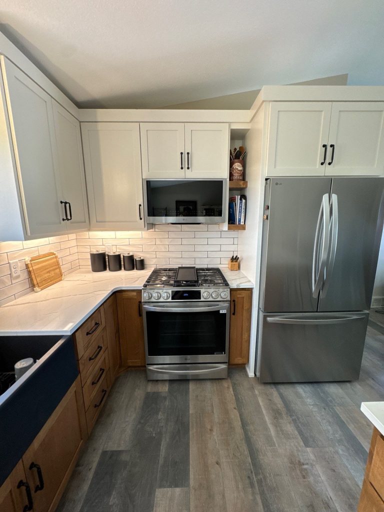 Modern kitchen with stainless steel appliances and white cabinets