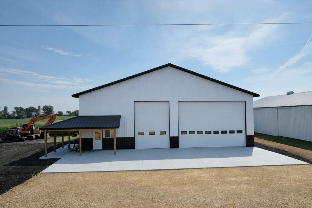 White metal workshop with two garage doors