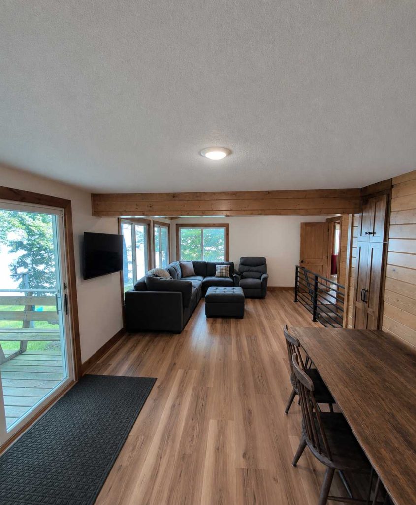 Modern rustic living room with sectional and wood floors