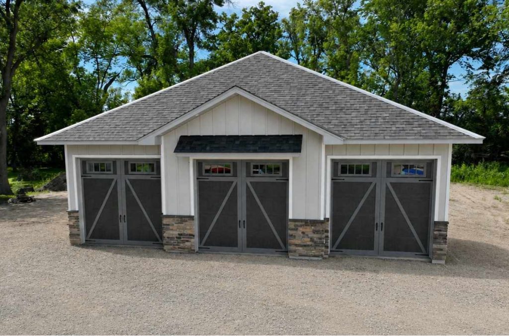 Three-car detached garage with gray barn-style doors
