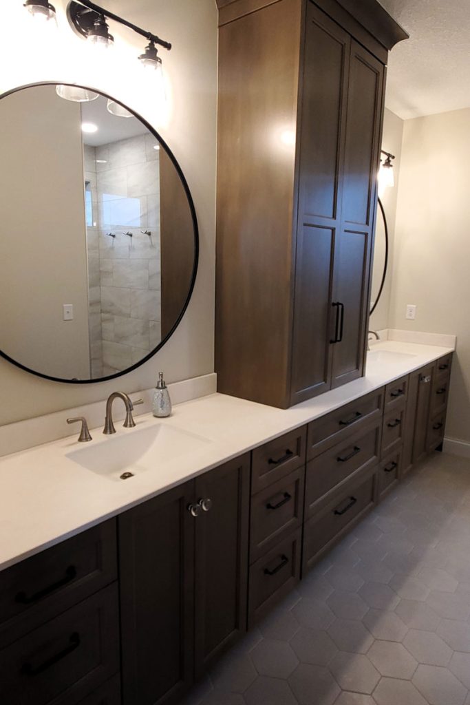 Modern bathroom vanity with double sinks and round mirrors