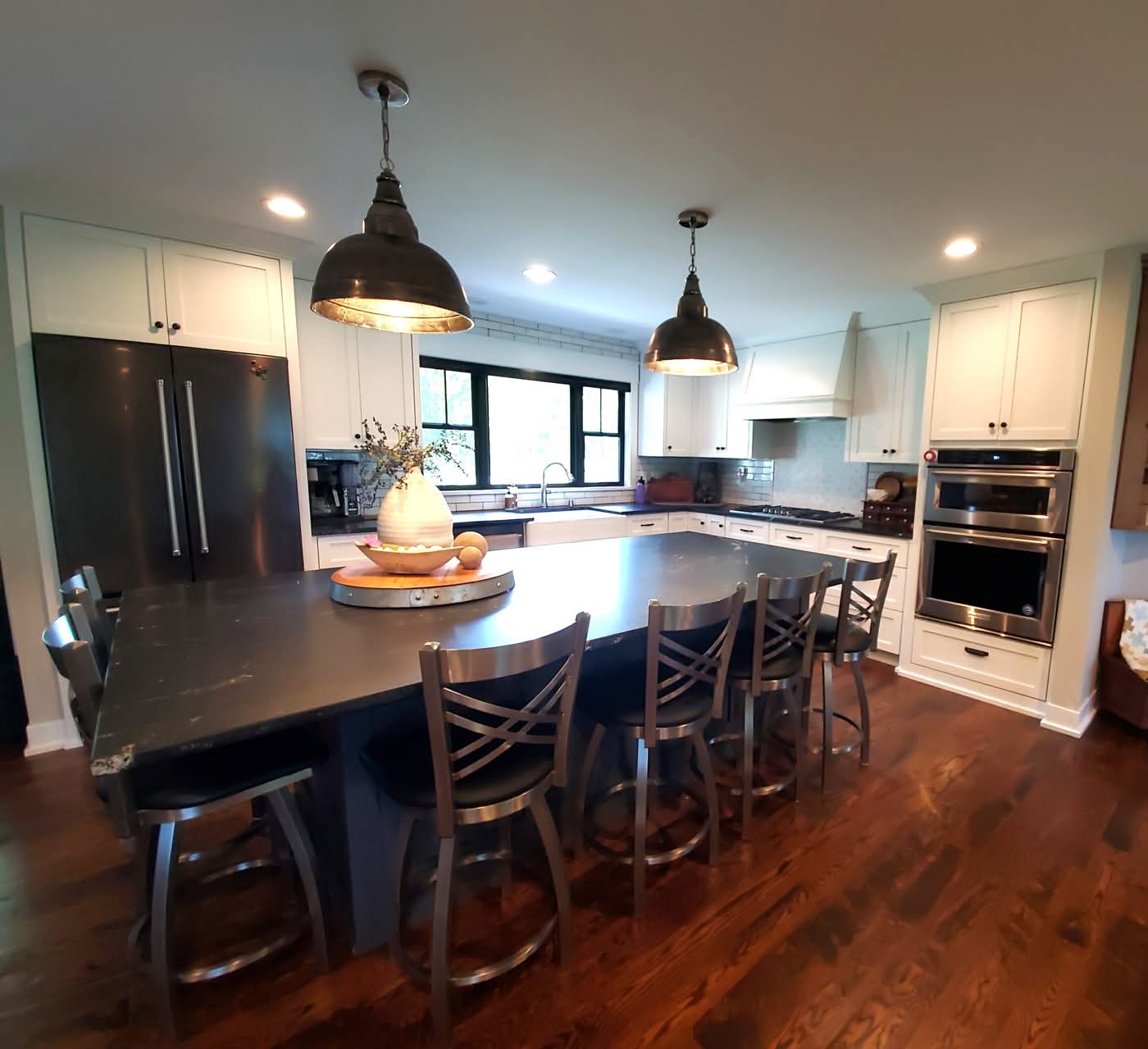Modern kitchen with large island and pendant lights